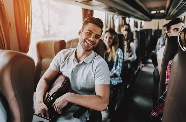 young people on tour bus iStock-1061230546 760x500